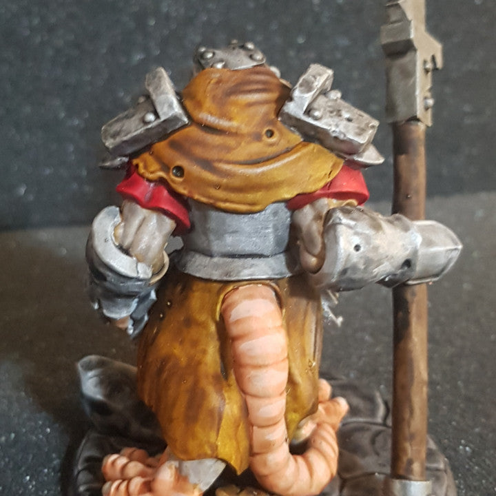 a figurine of a knight holding a sword