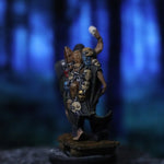 a figurine of a man holding a bat