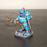 a toy figurine of a blue creature holding a sword