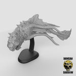 a model of a dragon head on a stand