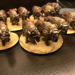 a table topped with small figurines of animals