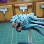 a close up of a toy monster on a table