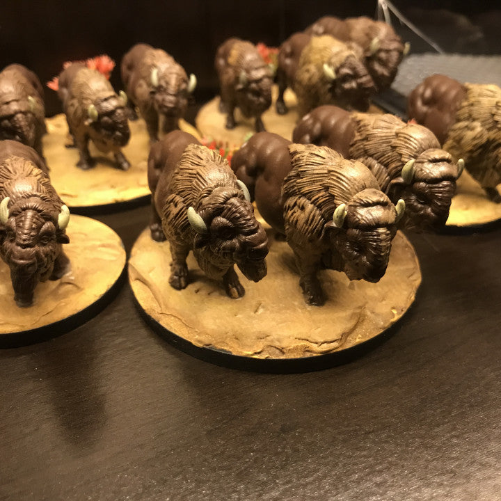 a table topped with small figurines of animals