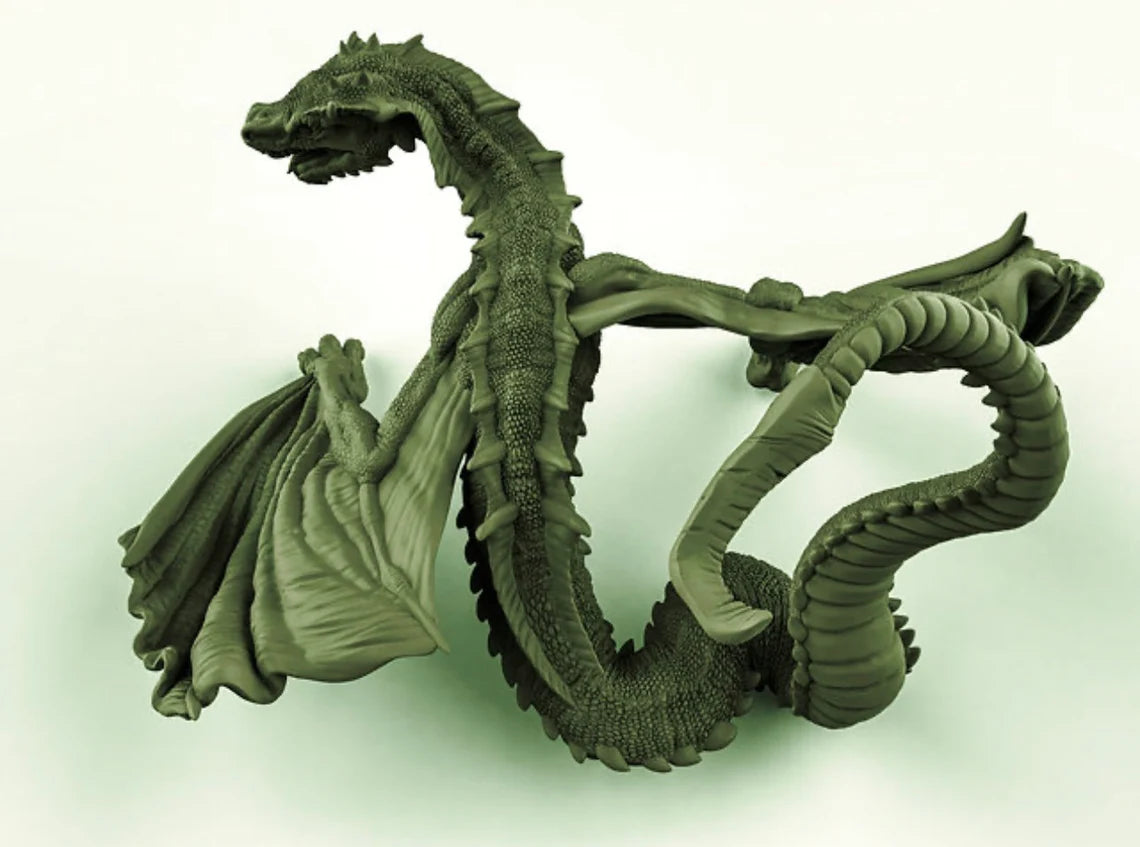 a green dragon statue sitting on top of a table